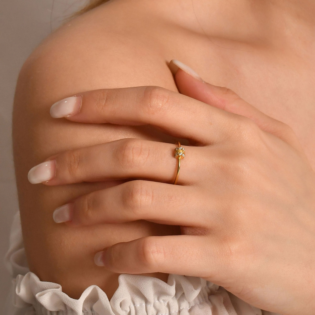 10K gold vertical bar cubic zirconia ring worn on hand, side view
