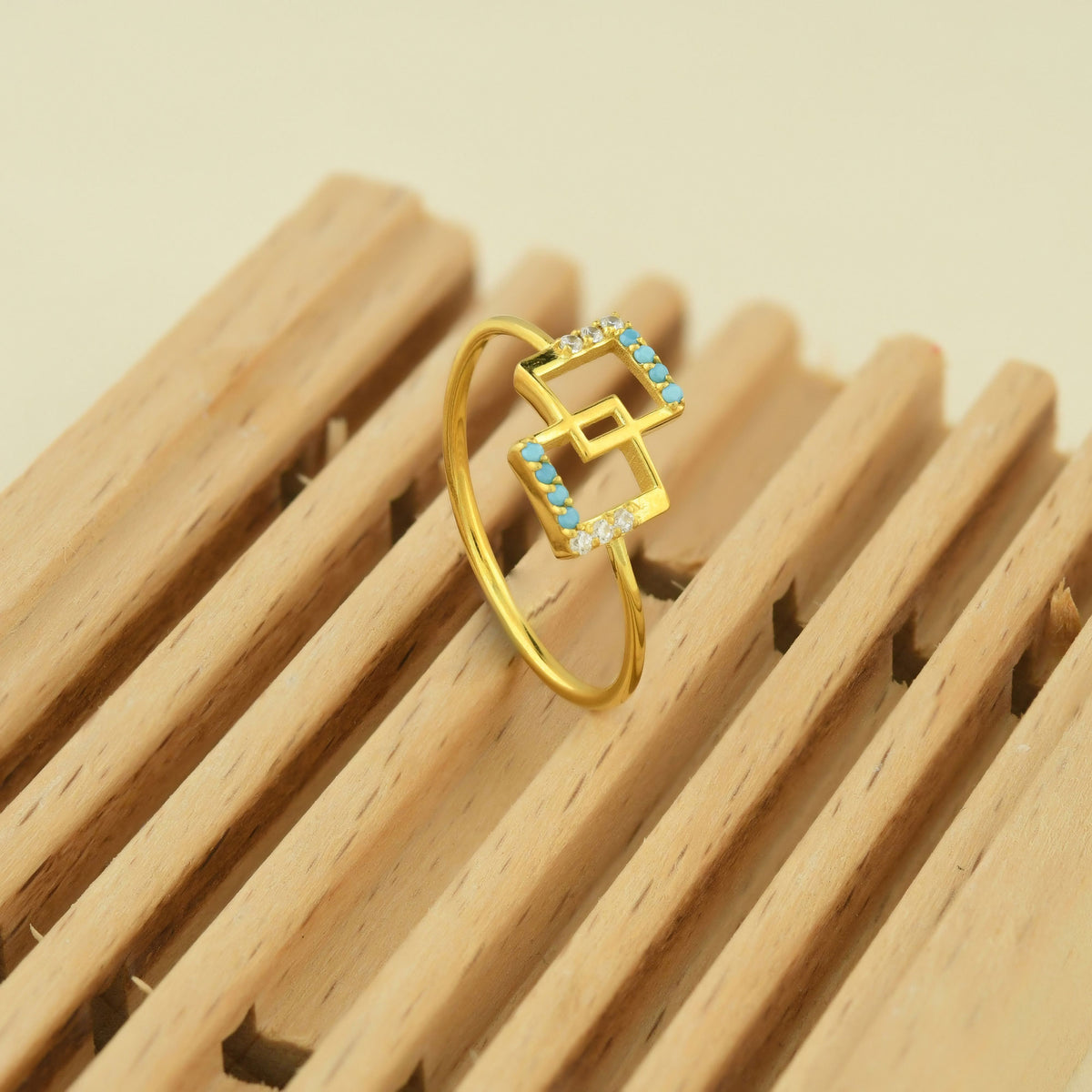 10K gold geometric square ring with turquoise stones and natural diamonds on display