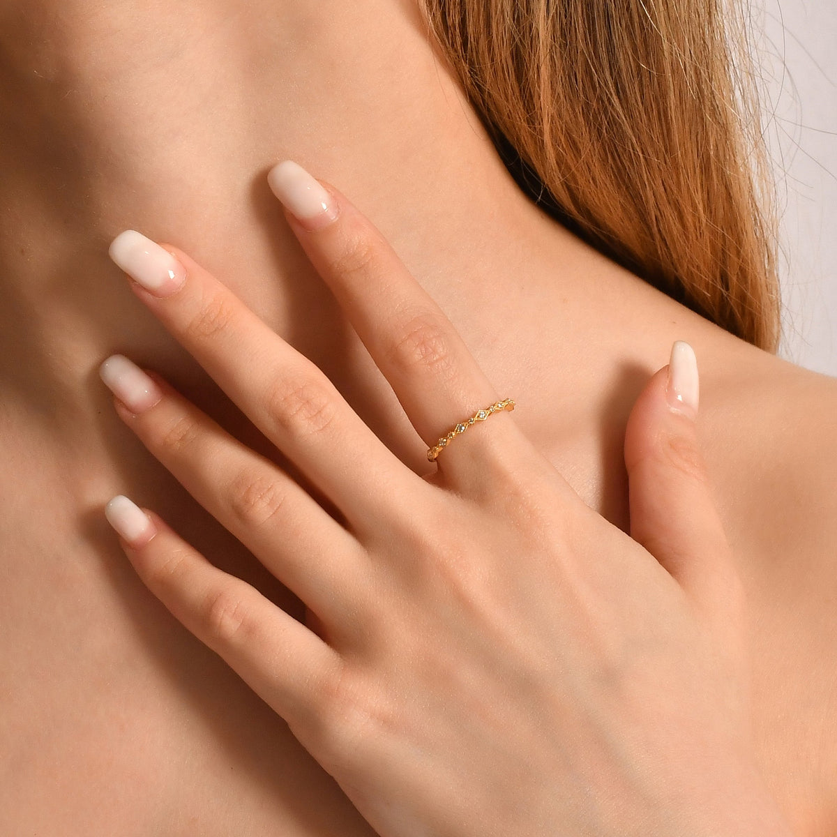 14K gold milgrain stackable cubic zirconia ring worn on hand