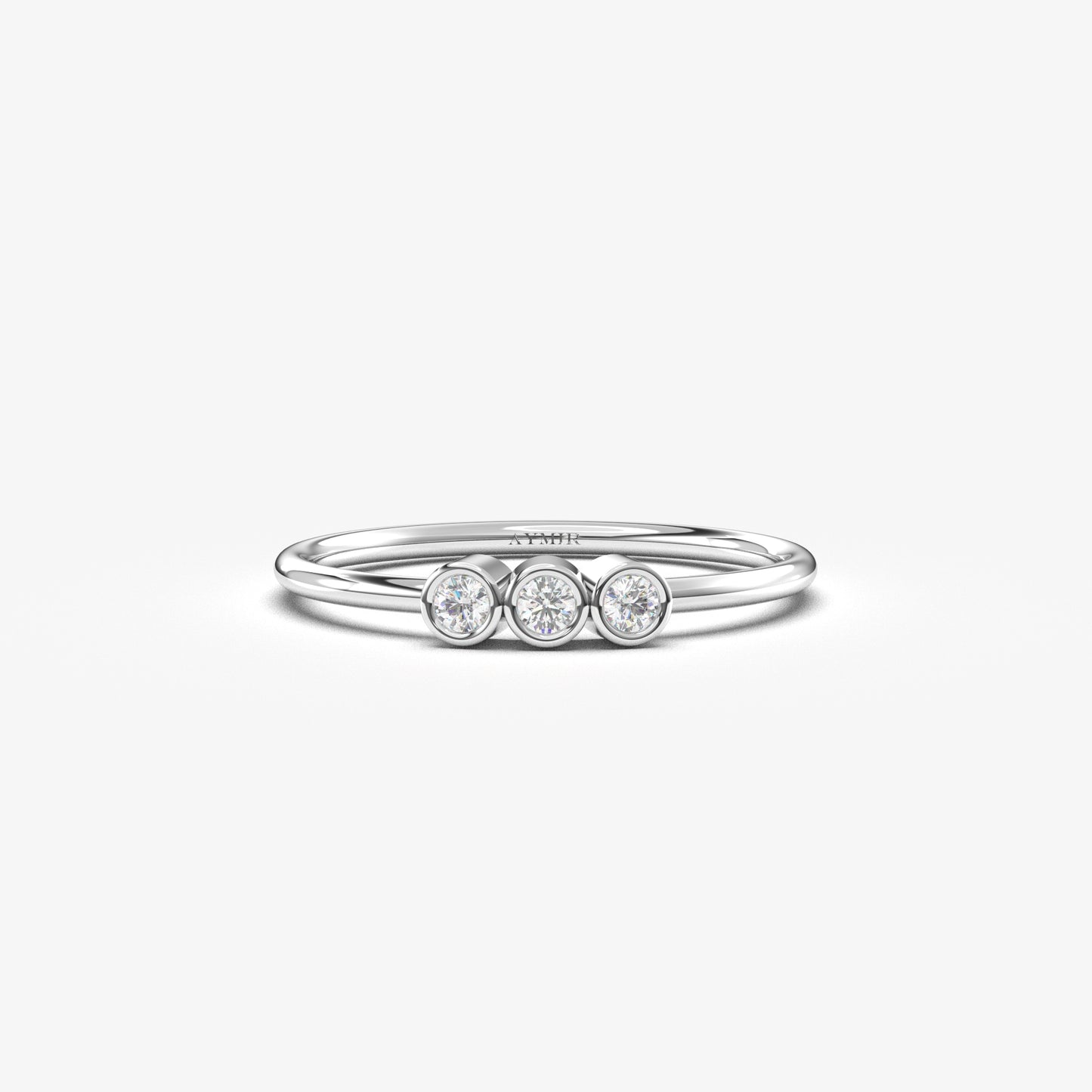 18K white gold three stone bezel ring with cubic zirconia, front view