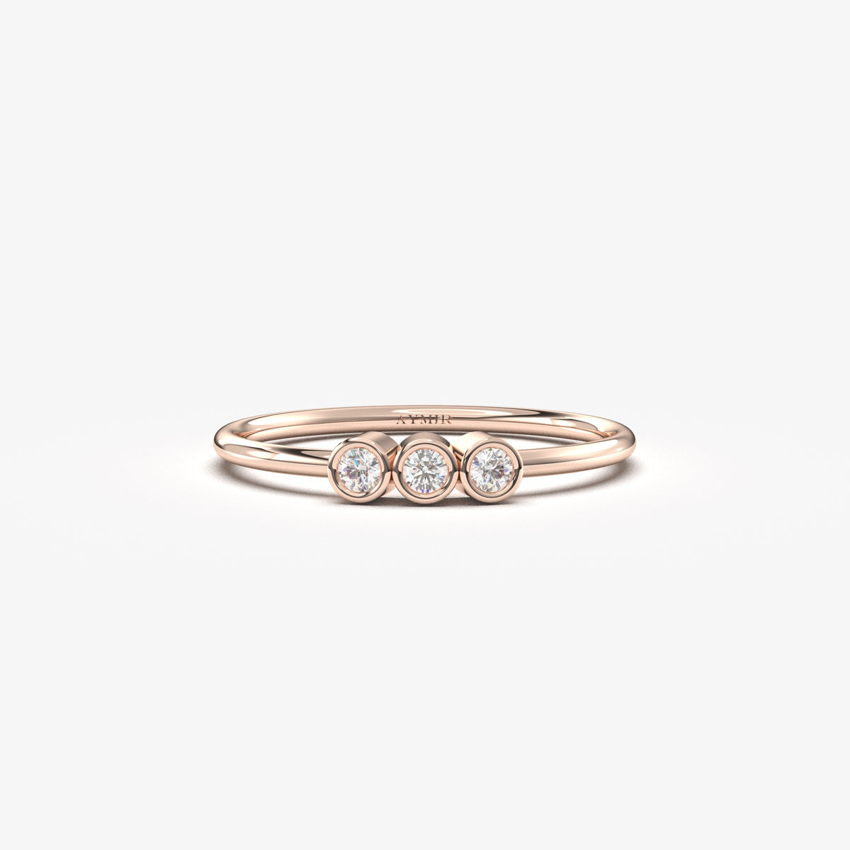 14K rose gold three stone bezel ring with cubic zirconia, front view