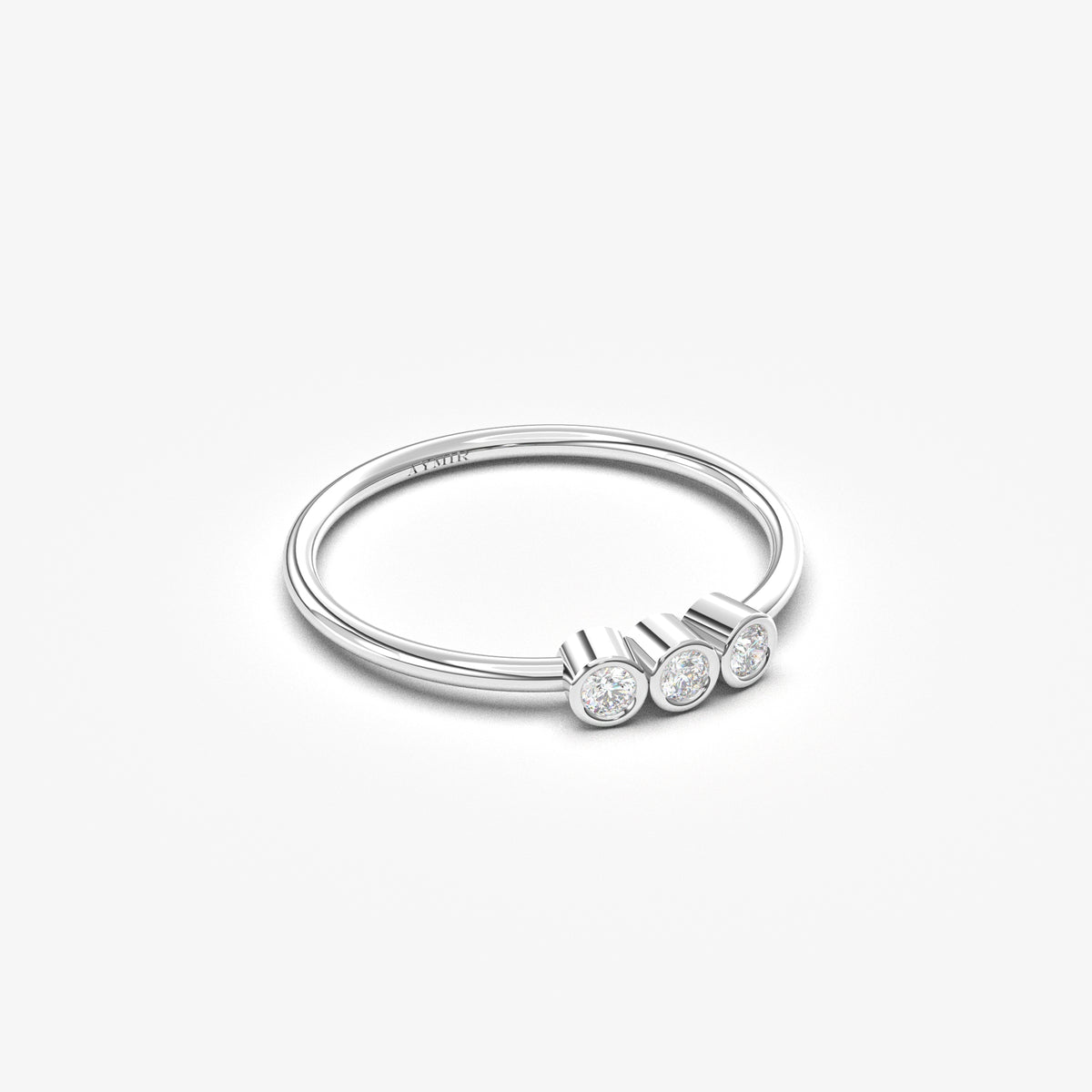 14K white gold three stone bezel ring with natural diamonds, angled view