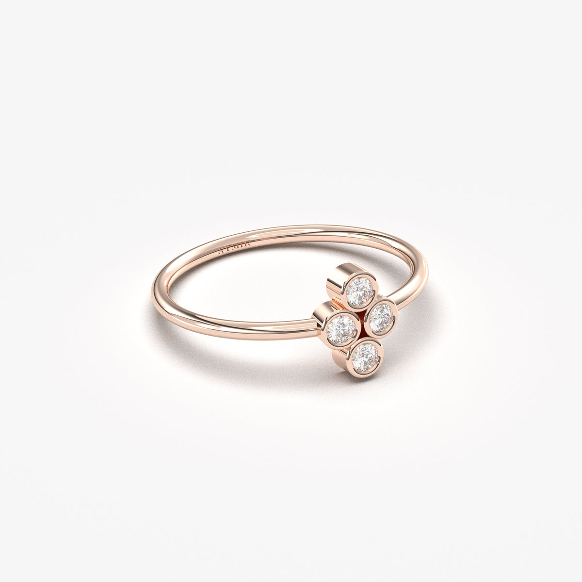 18K rose gold clover ring with natural diamonds, angled view