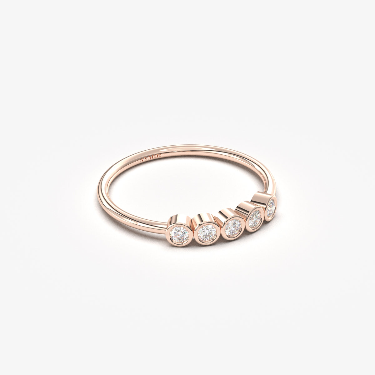 14K rose gold five stone bezel ring with cubic zirconia, angled view