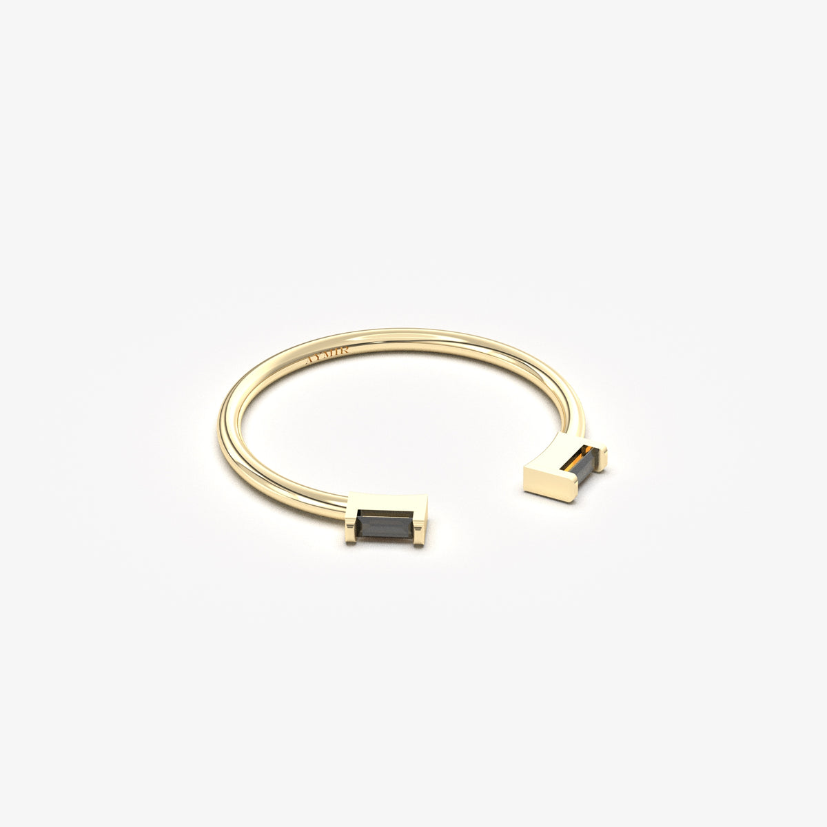 18K yellow gold open baguette ring with black baguette stones, angled view