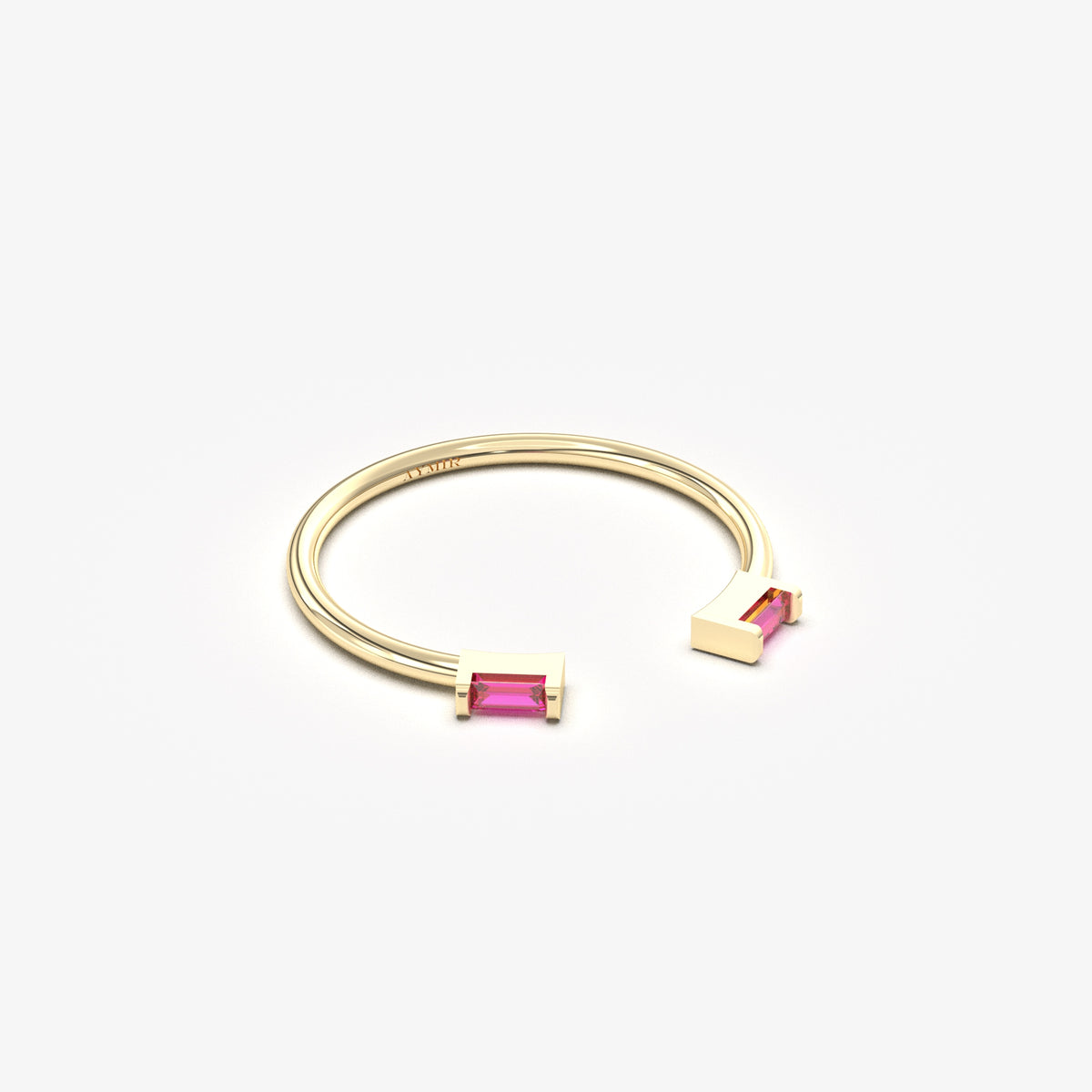 10K yellow gold open baguette ring with red baguette stones, angled view