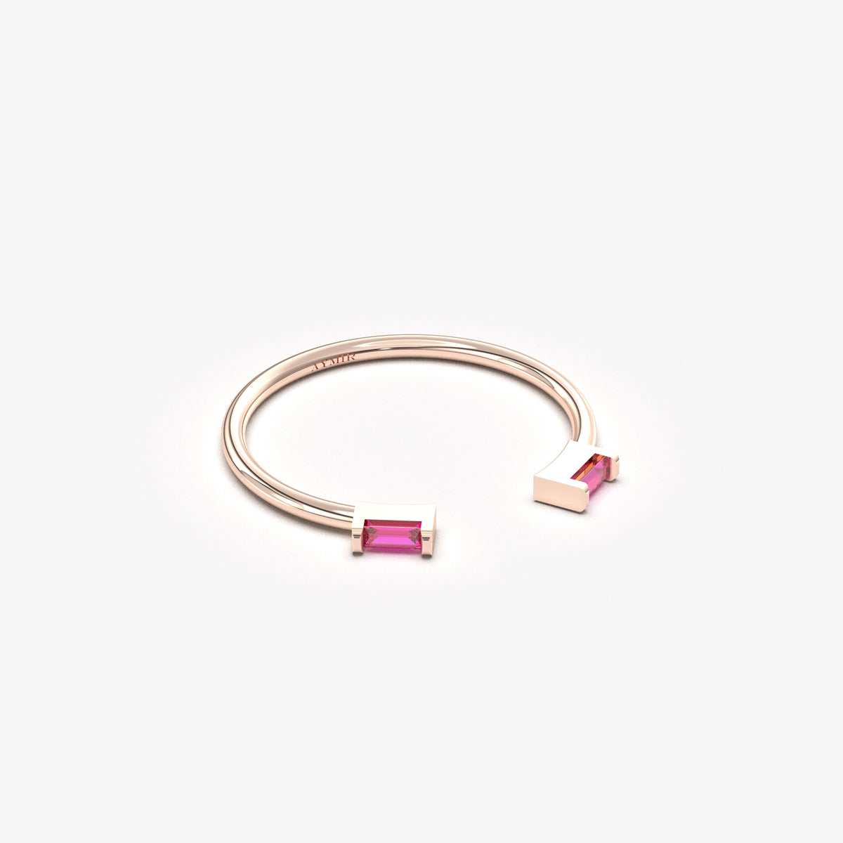 14K rose gold open baguette ring with red baguette stones, angled view