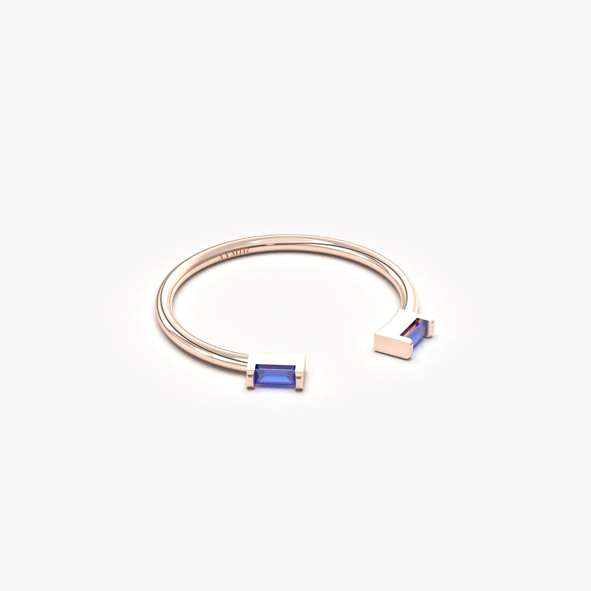 10K rose gold open baguette ring with blue baguette stones, angled view