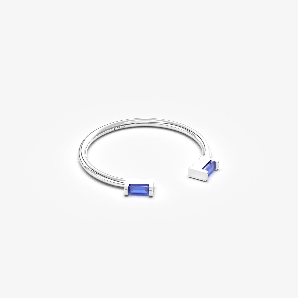 18K white gold open baguette ring with blue baguette stones, angled view