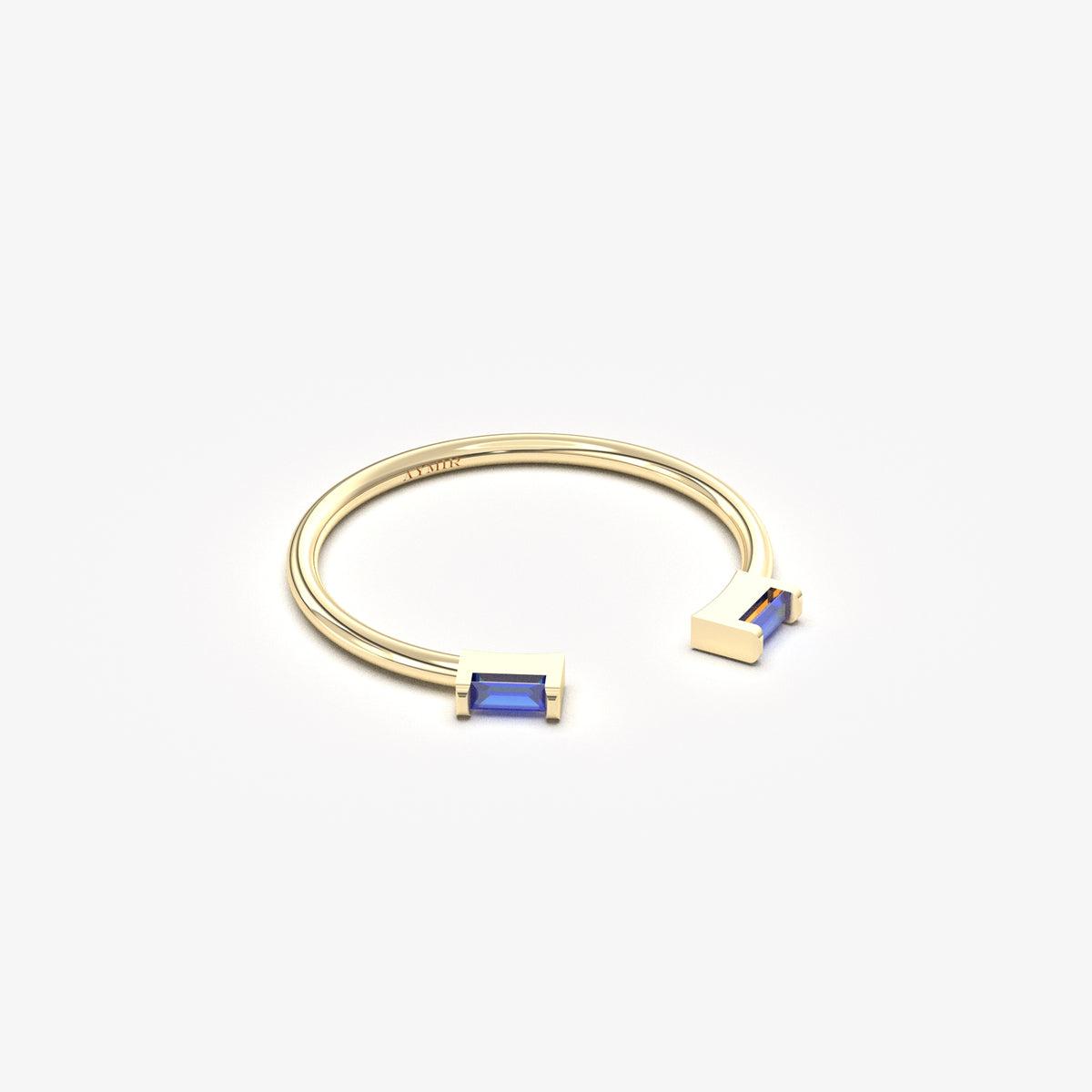 10K yellow gold open baguette ring with blue baguette stones, angled view
