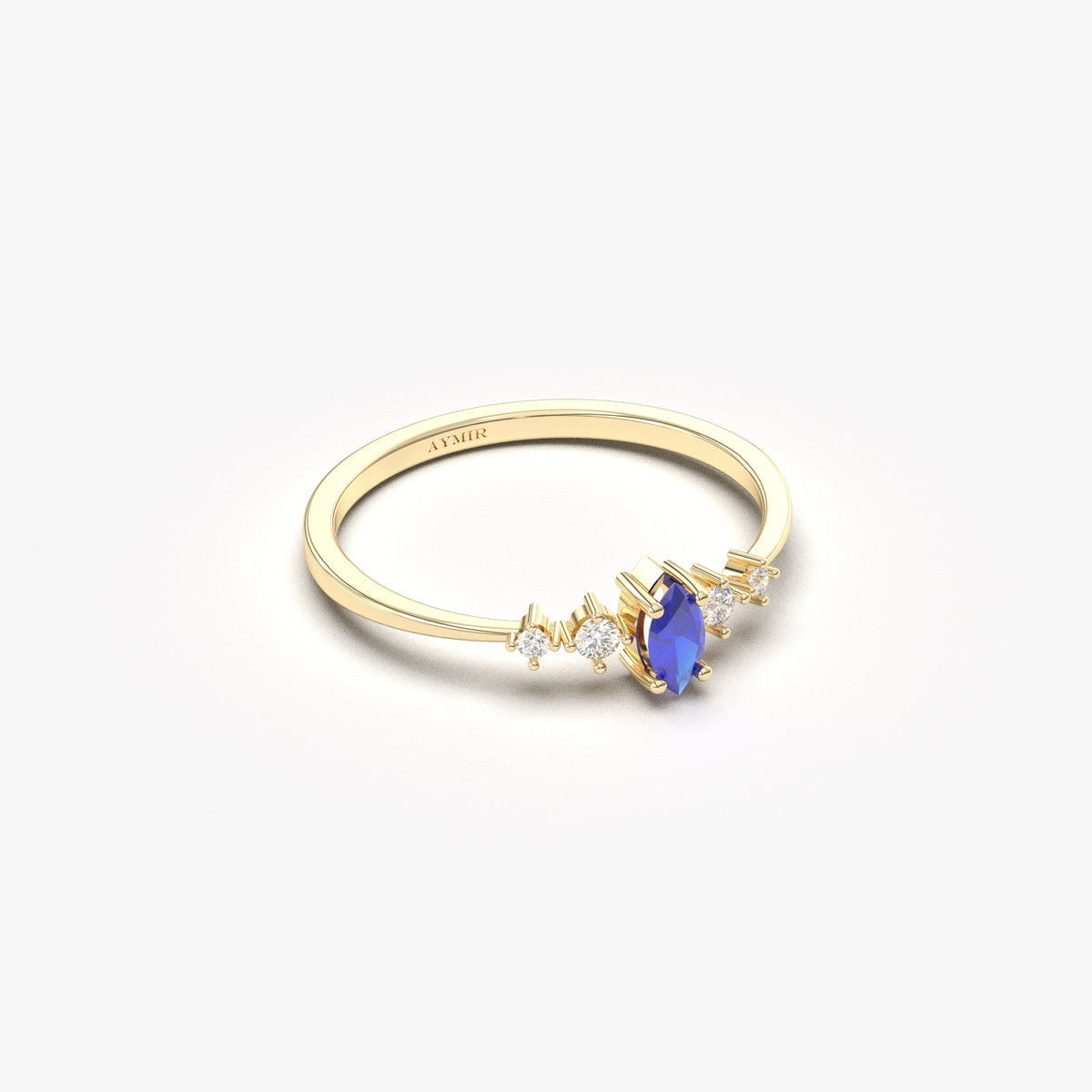 Yellow gold blue-stone marquise ring, angled view