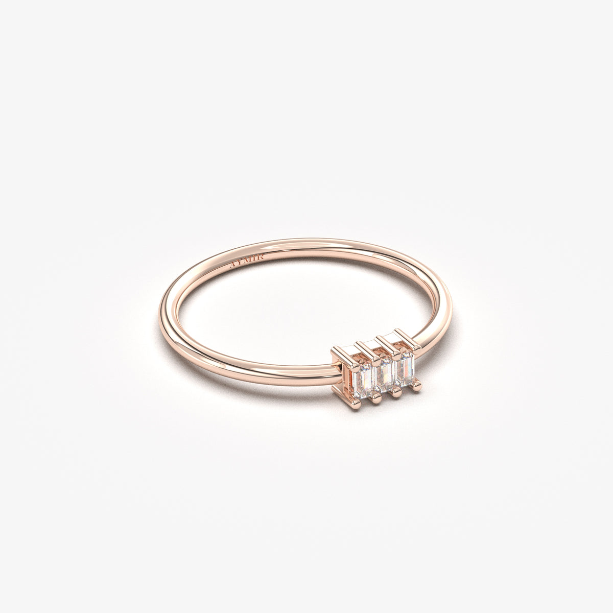 14K rose gold three baguette ring with cubic zirconia, angled view