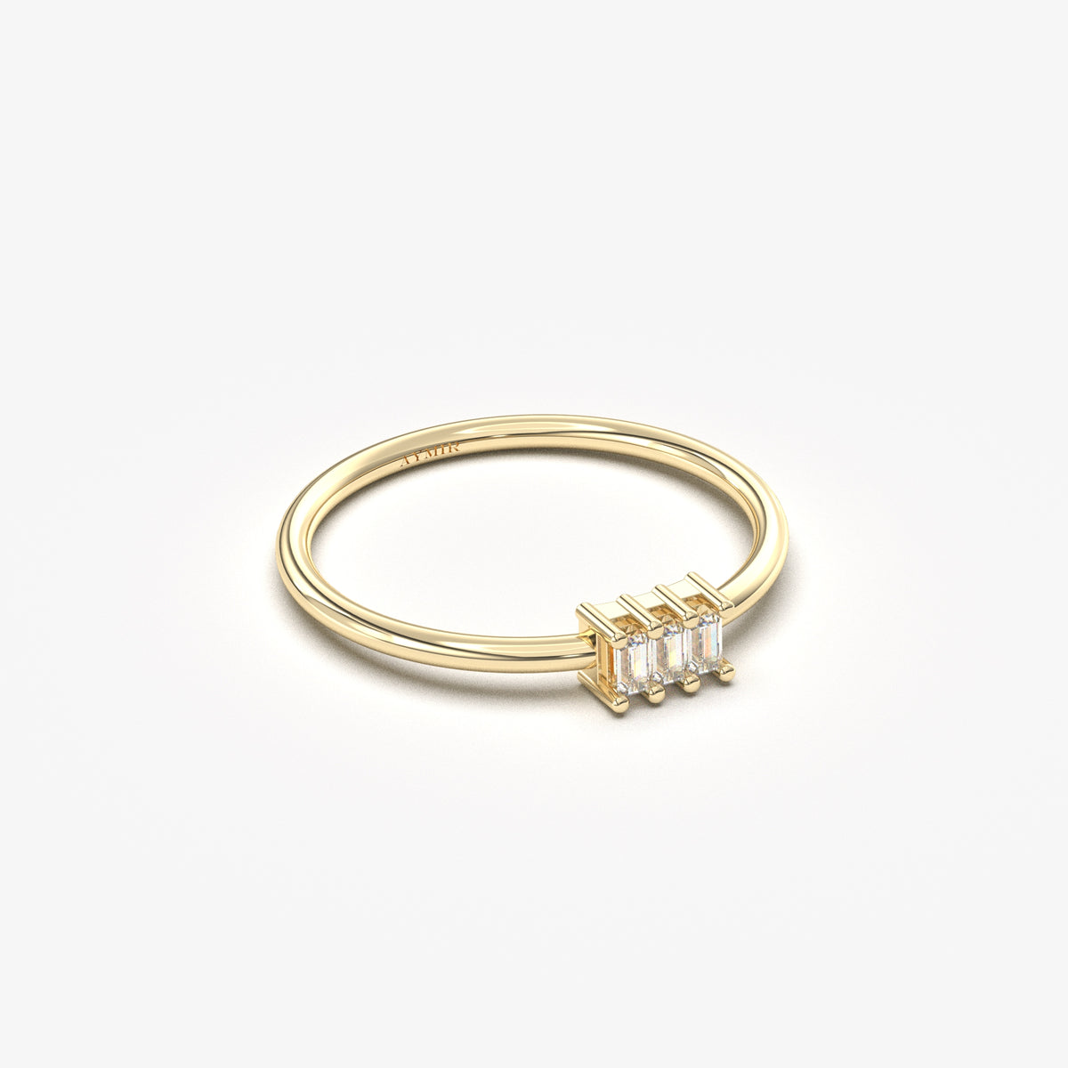 18K yellow gold three baguette ring with cubic zirconia, angled view