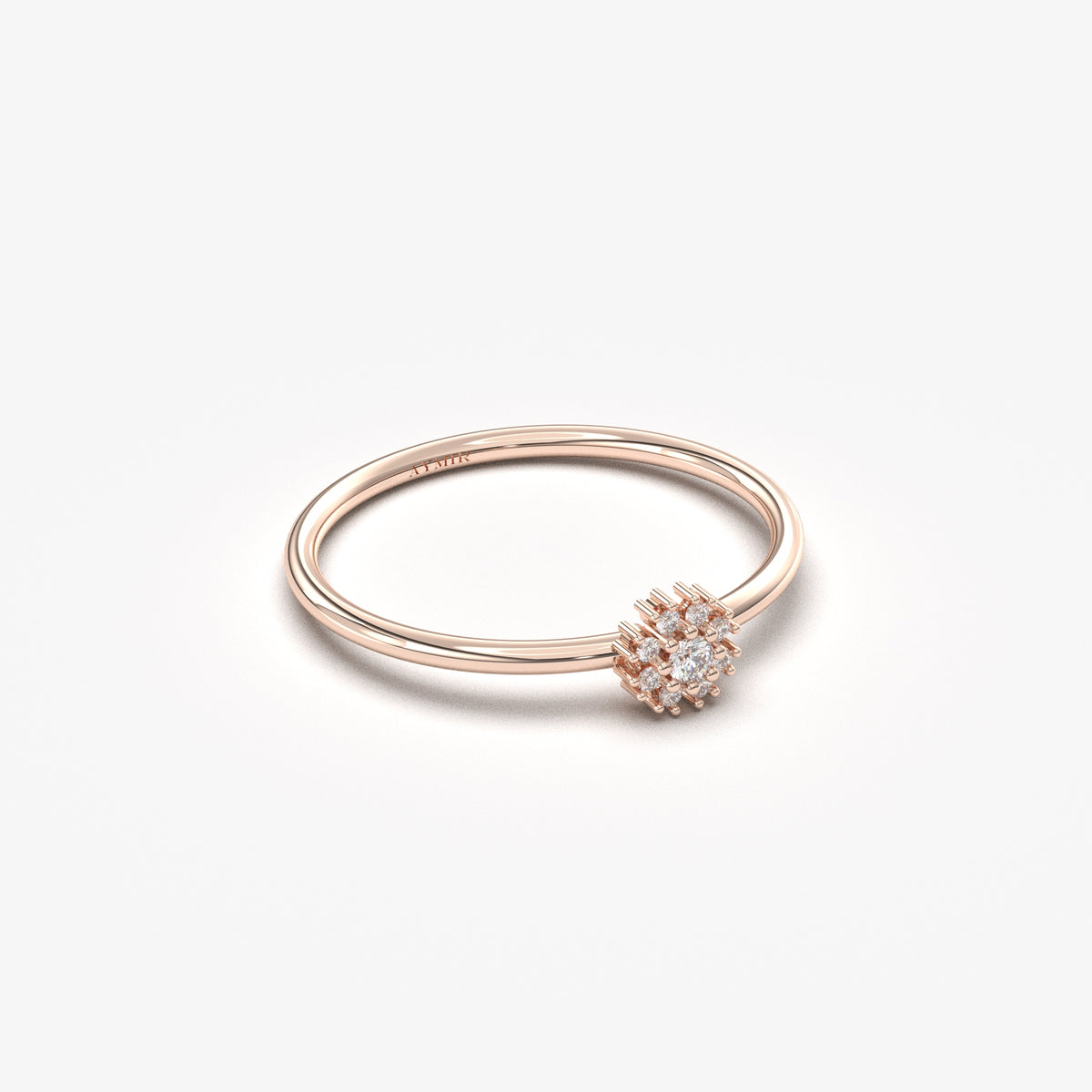 10K rose gold flower halo ring with cubic zirconia, angled view