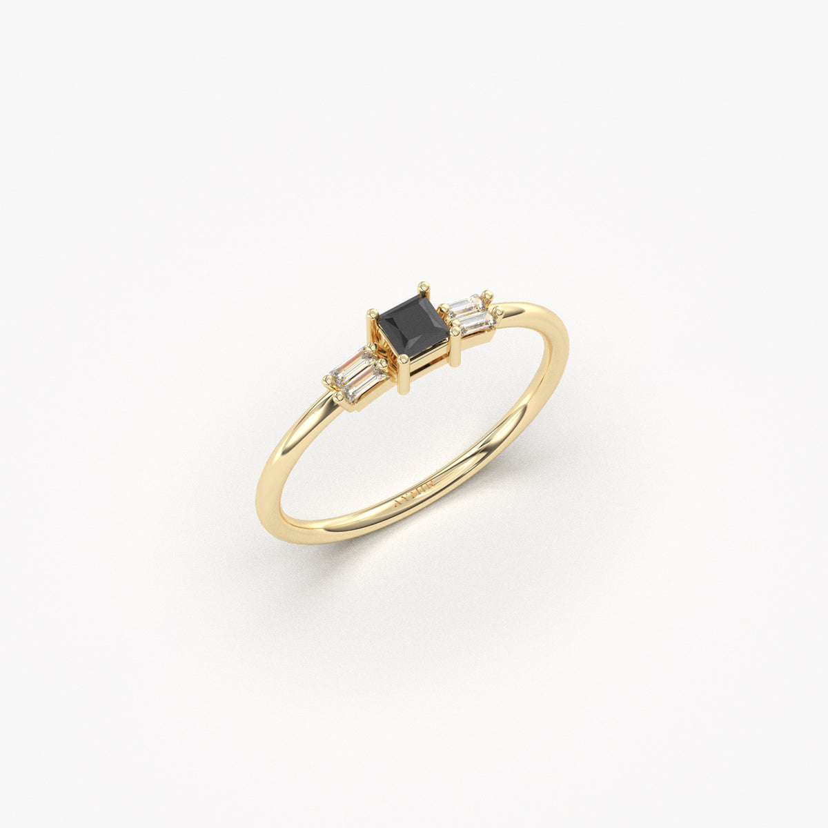 Yellow gold black-stone baguette ring, angled view