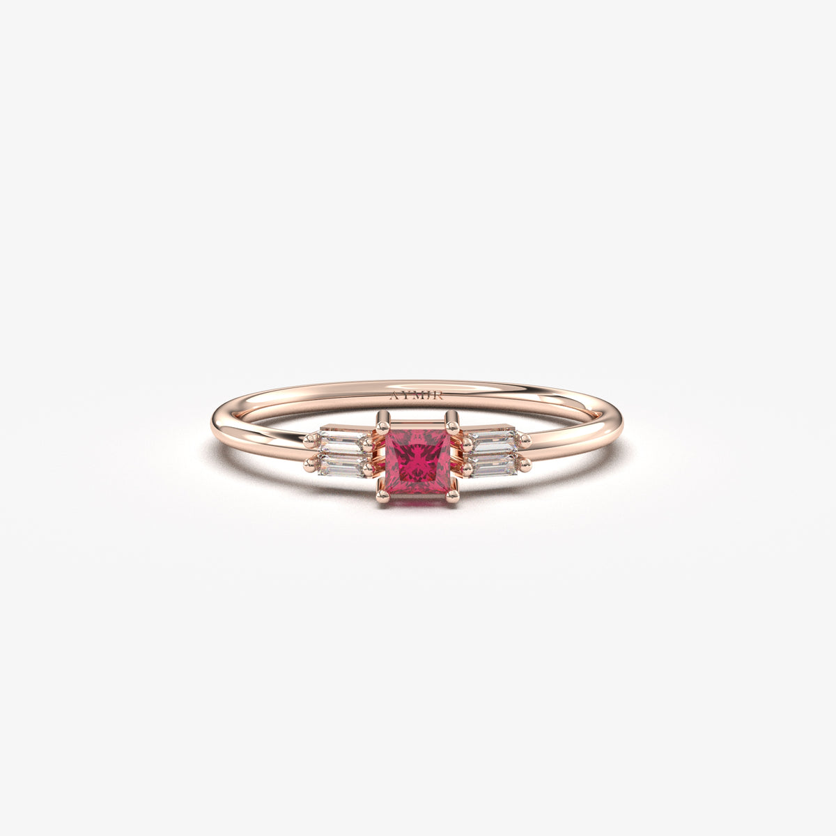 Rose gold red-stone baguette ring, front view