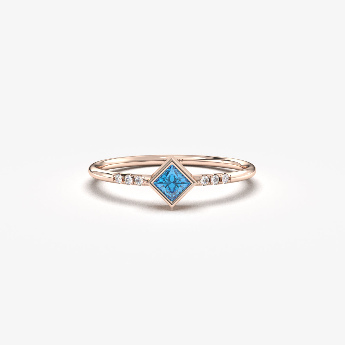 18K rose gold blue-stone princess ring with cubic zirconia, front view
