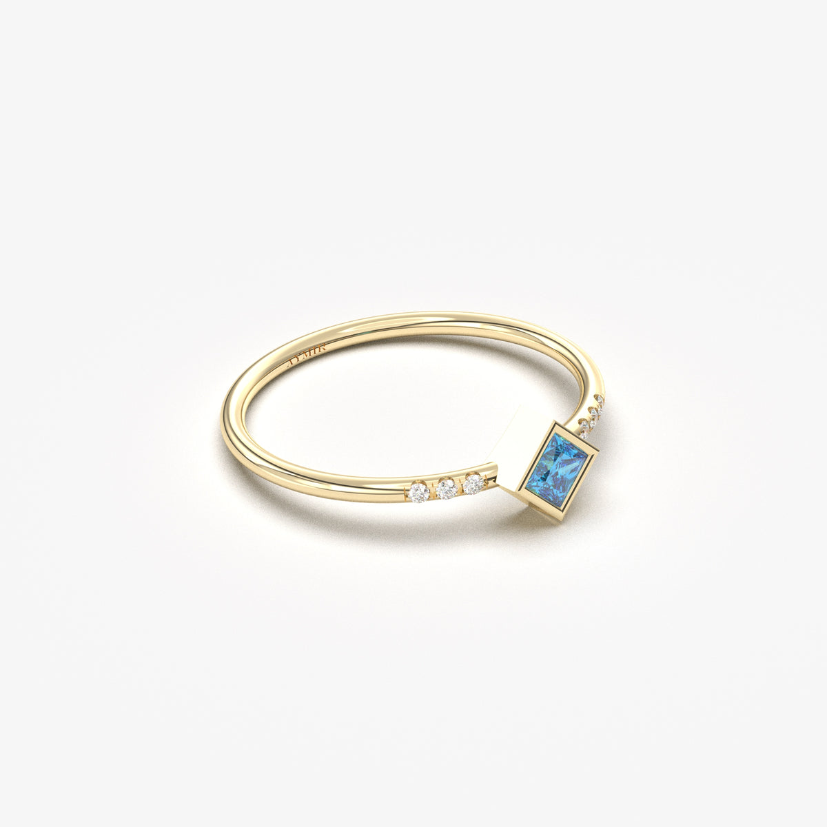 10K yellow gold blue-stone princess ring with cubic zirconia, angled view
