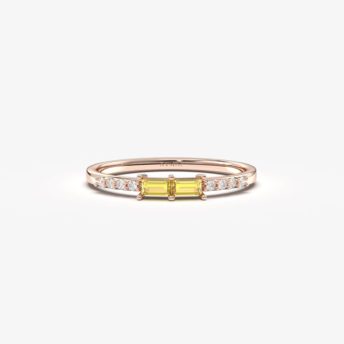 Rose gold yellow-stone baguette ring, front view