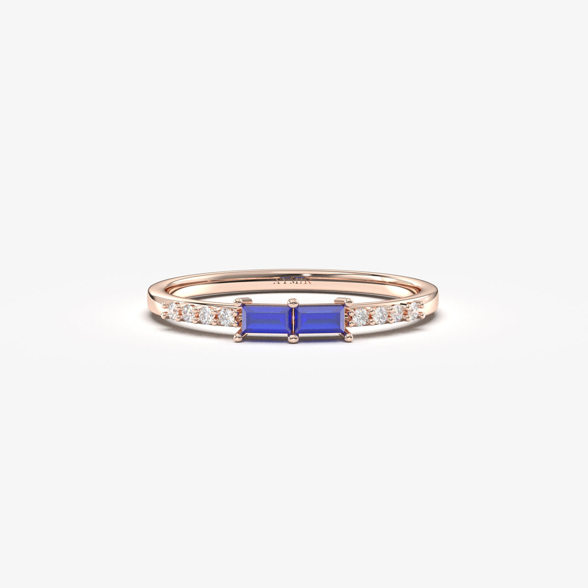 Rose gold blue-stone baguette ring, front view