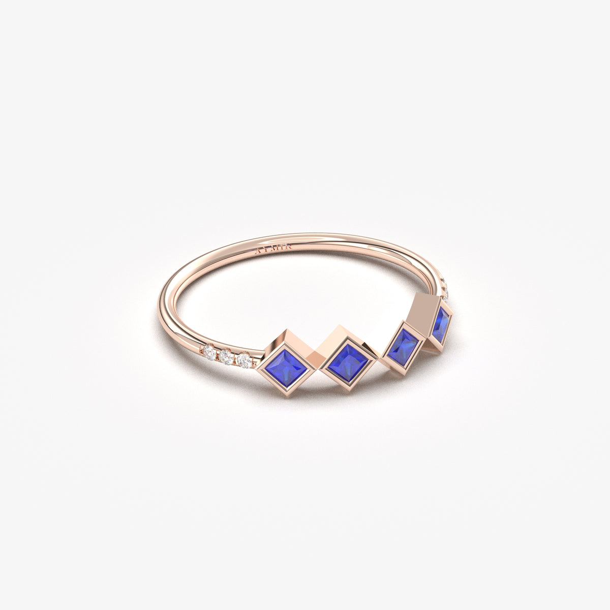 10K rose gold blue stone four princess ring with cubic zirconia, angled view