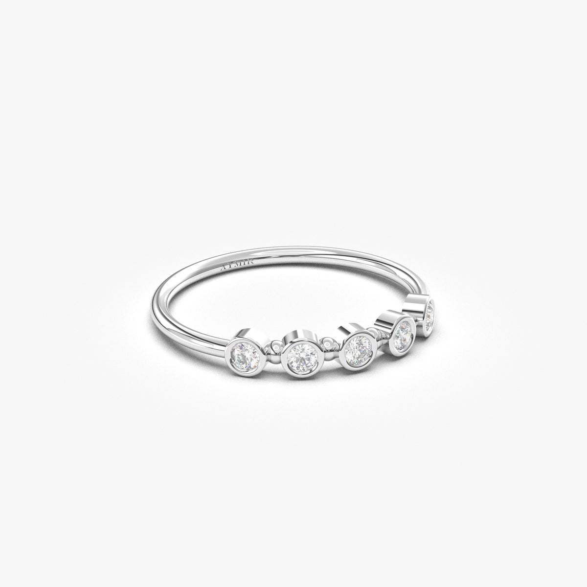 10K white gold five stone bezel ring with cubic zirconia, angled view