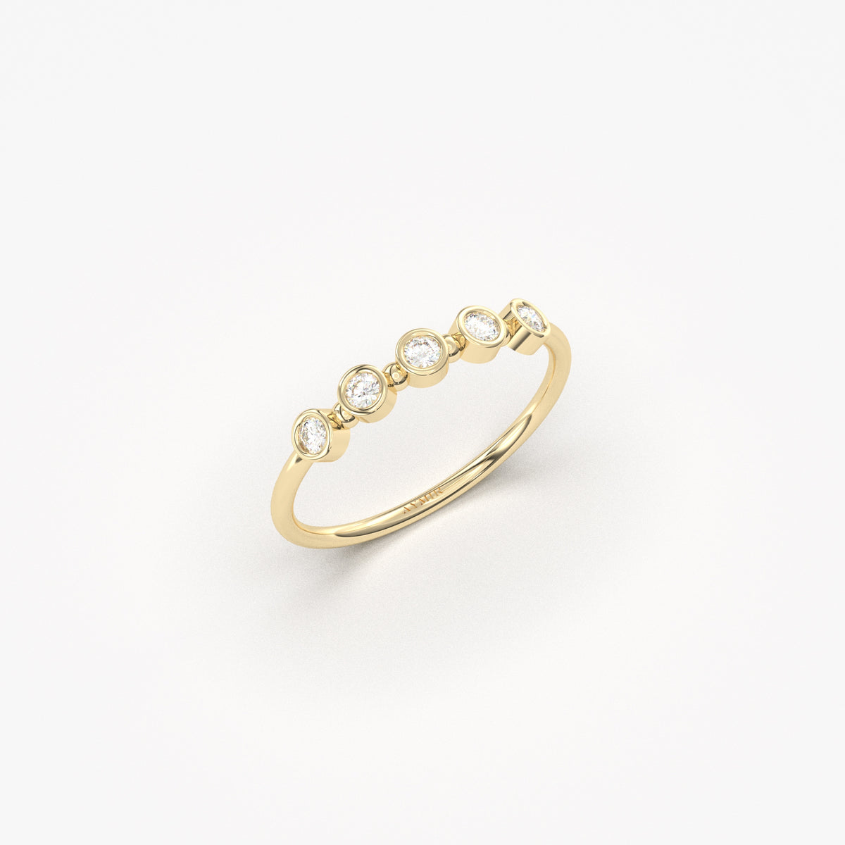 10K yellow gold five stone bezel ring with cubic zirconia, side view