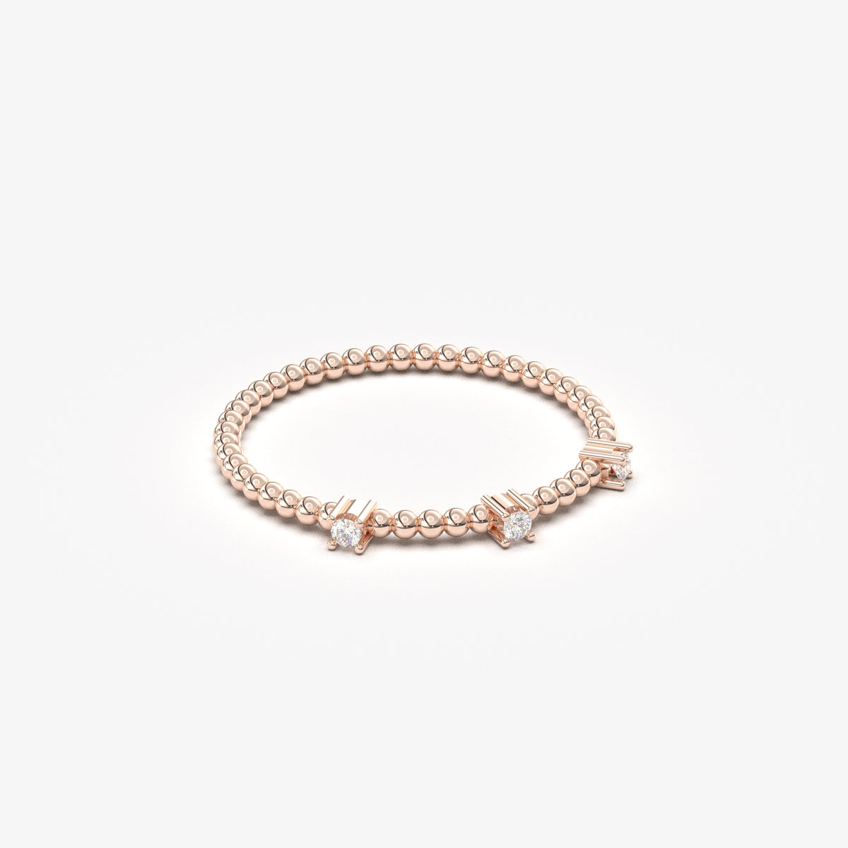 14K rose gold bubble band ring with natural diamonds, angled view