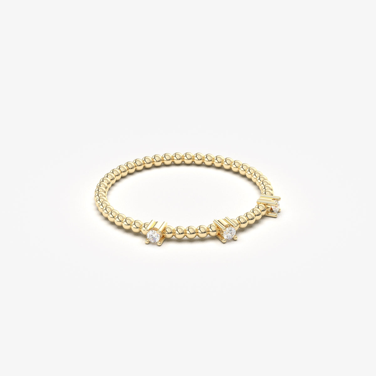 10K yellow gold bubble band ring with natural diamonds, angled view