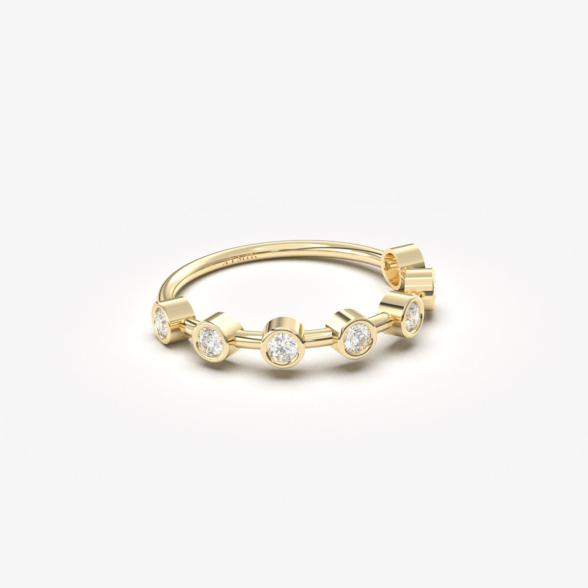 14K yellow gold seven stone bezel ring with natural diamonds, angled view