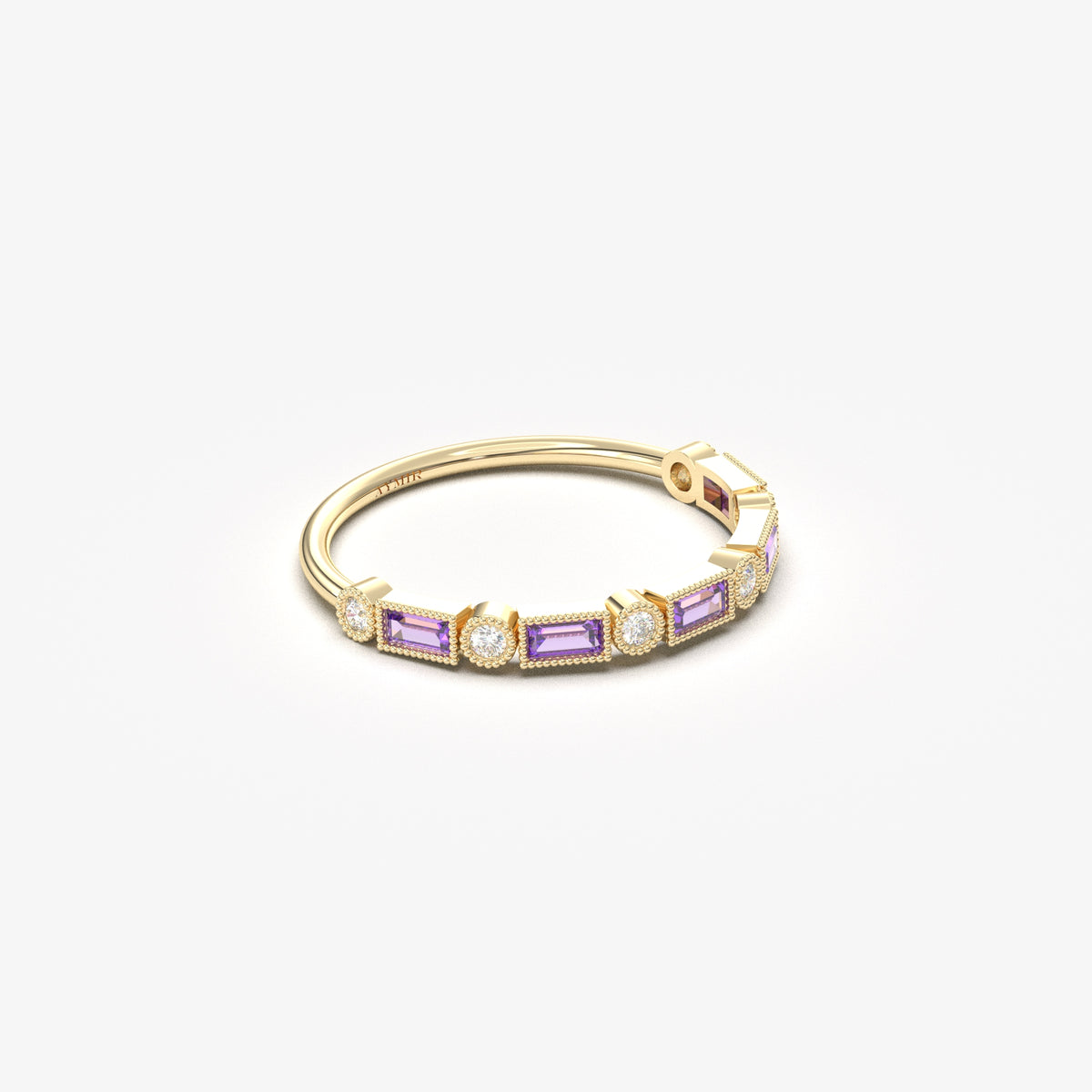 Yellow gold purple-stone baguette ring, angled view