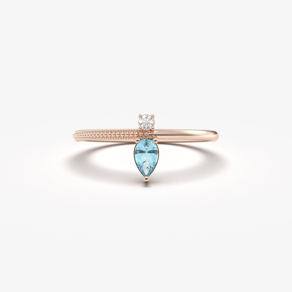Rose gold aqua-blue-stone pear ring, front view