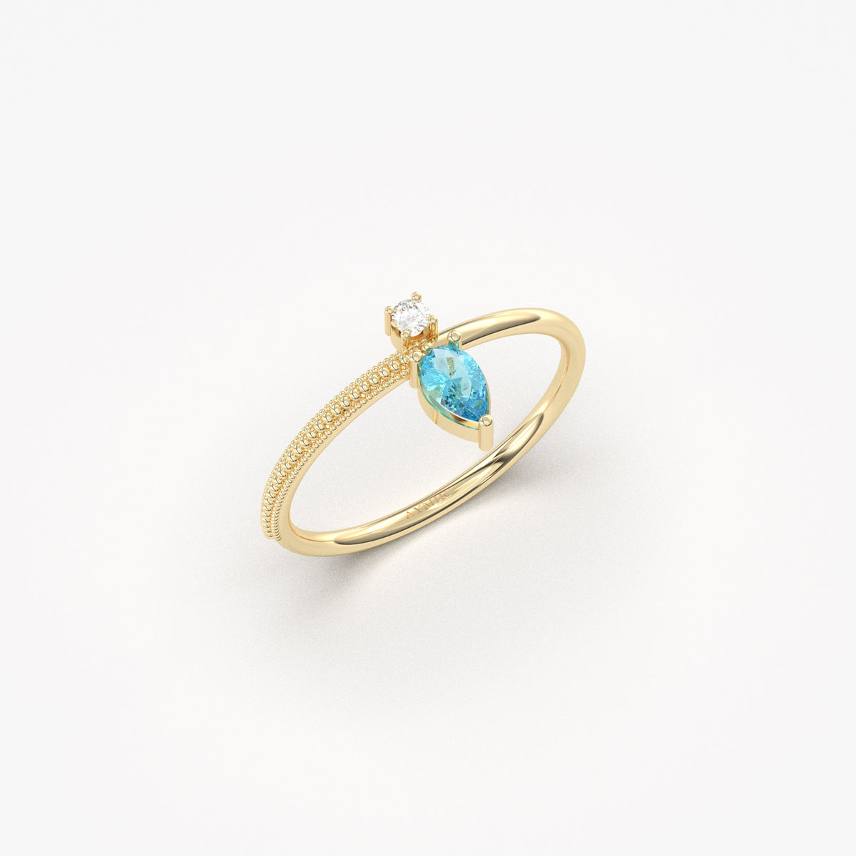Yellow gold aqua-blue-stone pear ring, angled view