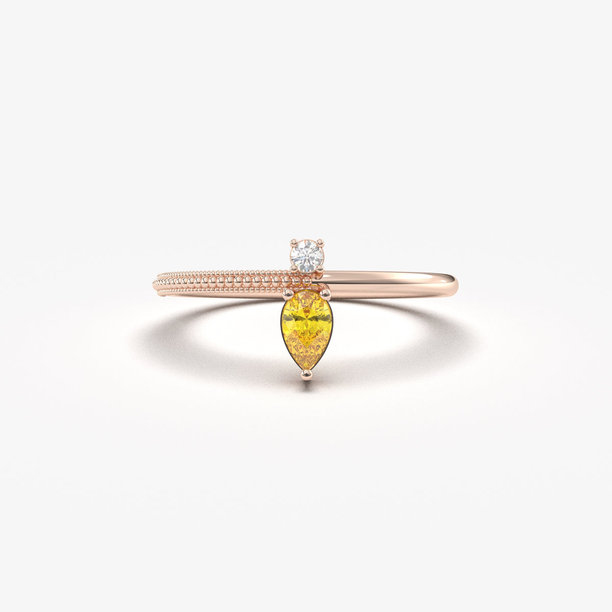 Rose gold yellow-stone pear ring, front view
