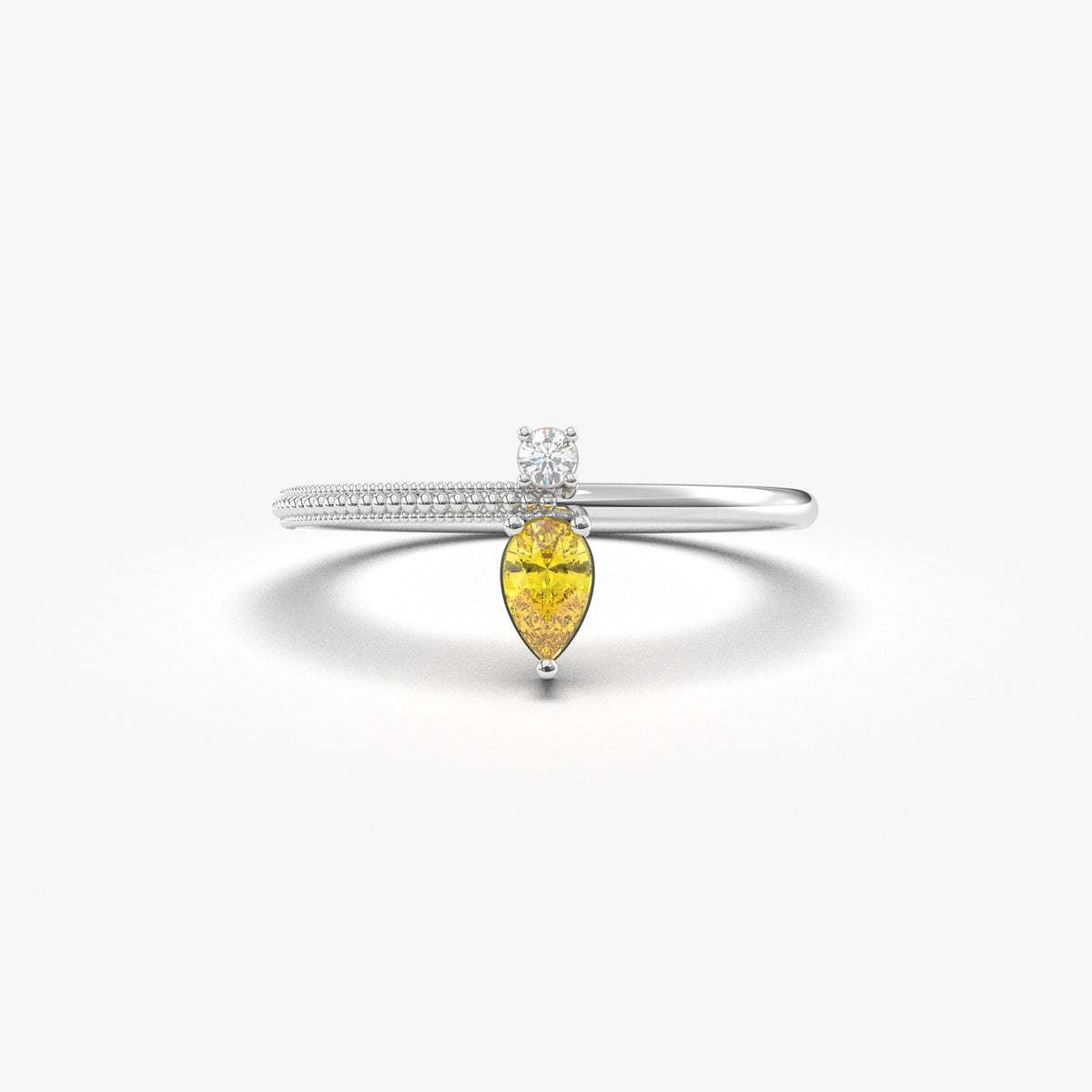 White gold yellow-stone pear ring, front view