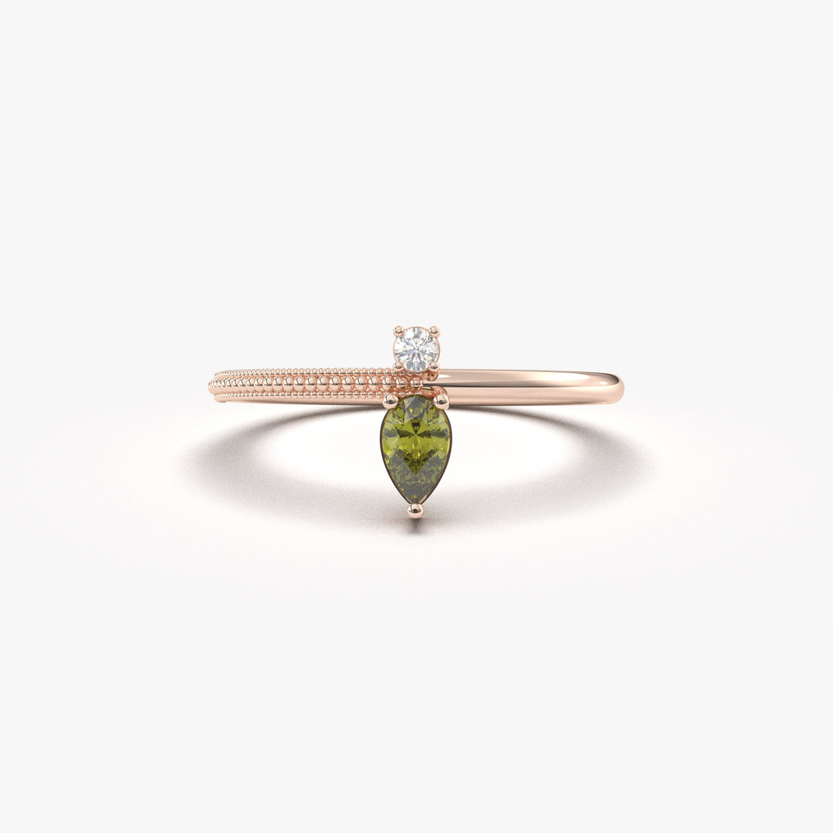 Rose gold green-stone pear ring, front view