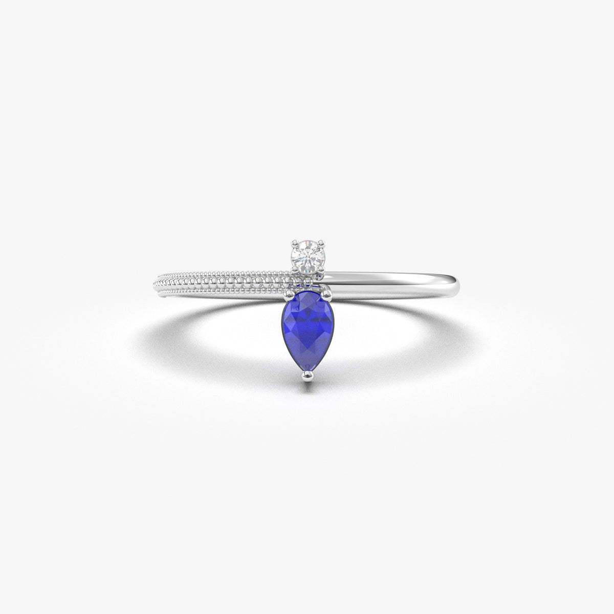White gold blue-stone pear ring, front view