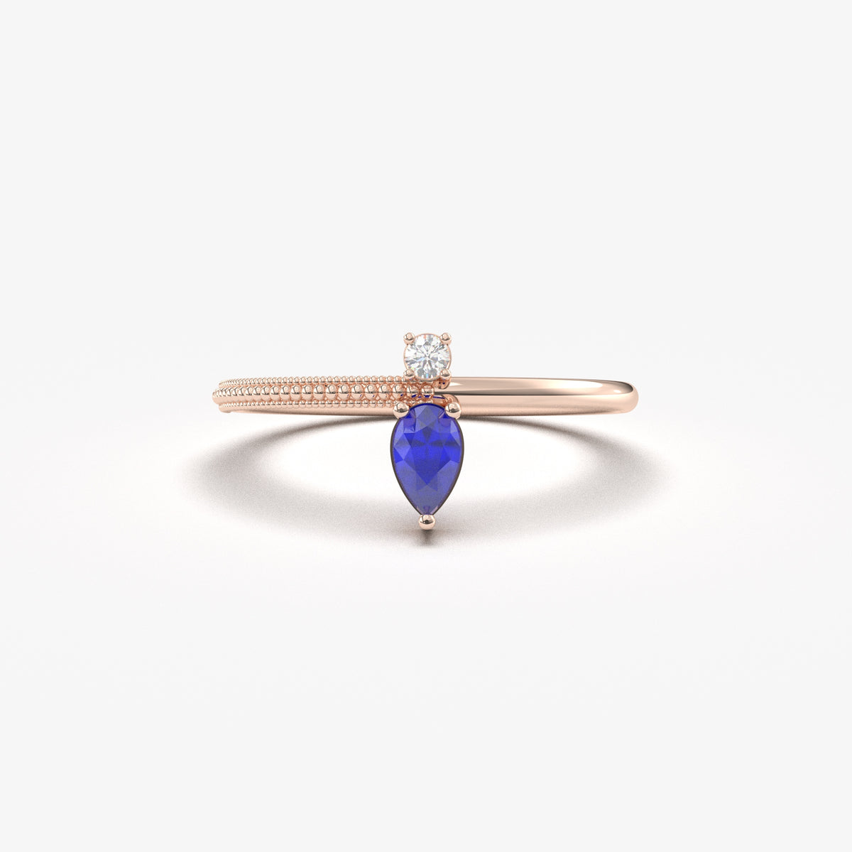 Rose gold blue-stone pear ring, front view