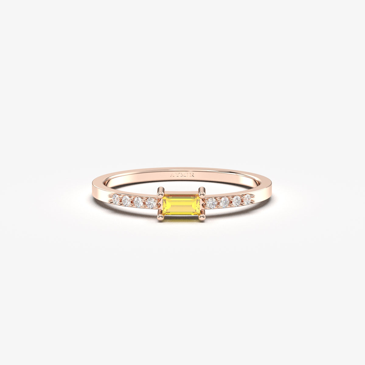 Rose gold yellow-stone baguette ring, front view