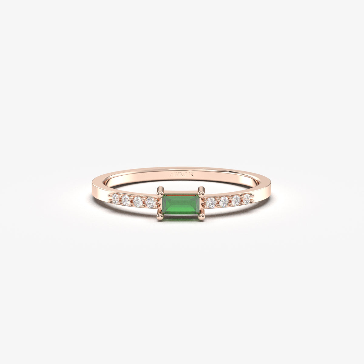 Rose gold green-stone baguette ring, front view