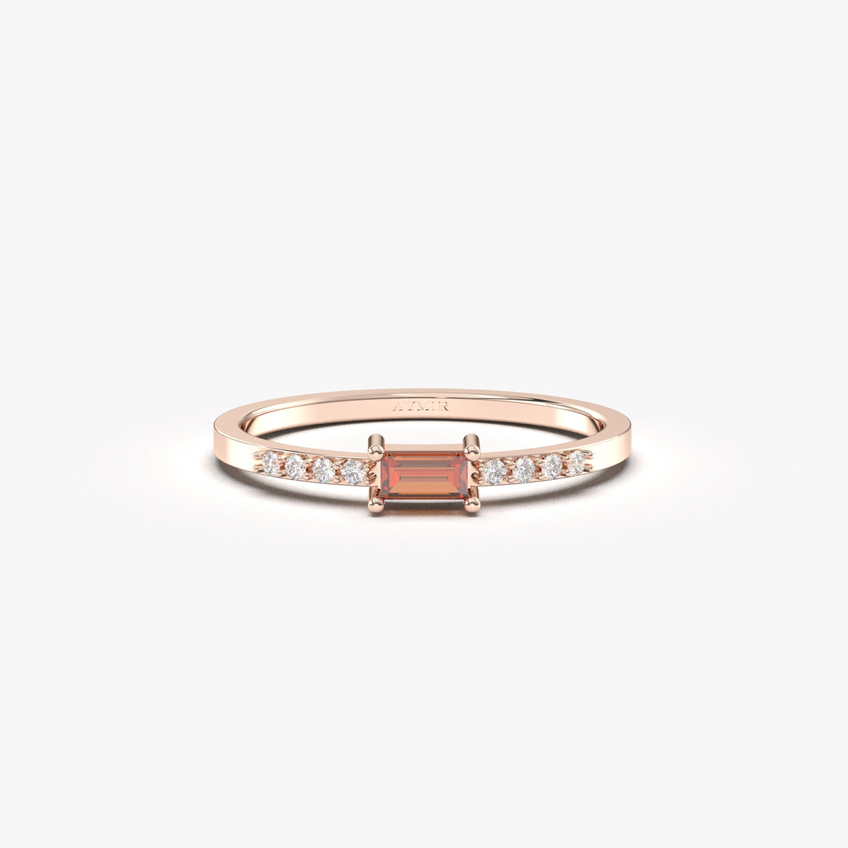 Rose gold dark-red-stone baguette ring, front view