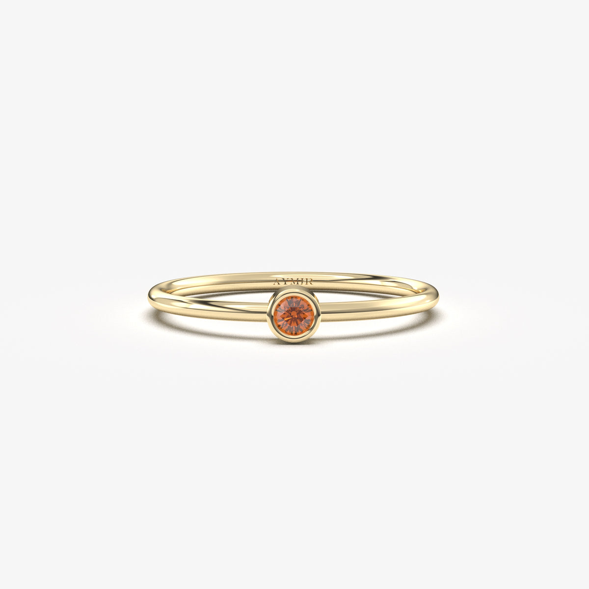 Yellow gold dark-red-stone bezel solitaire ring, front view