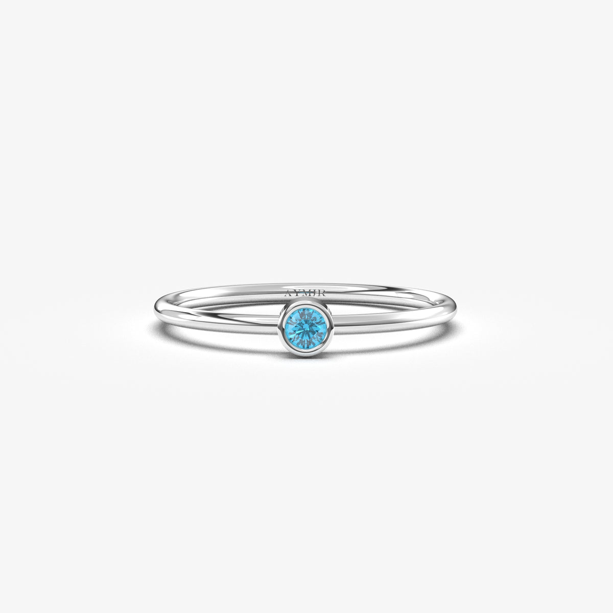 White gold light-blue-stone bezel solitaire ring, front view