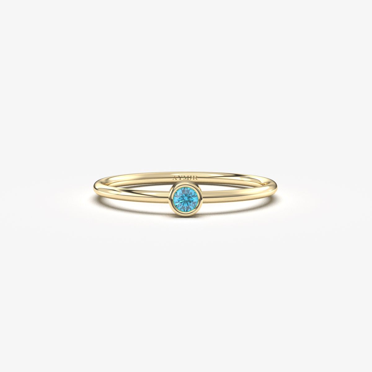 Yellow gold light-blue-stone bezel solitaire ring, front view