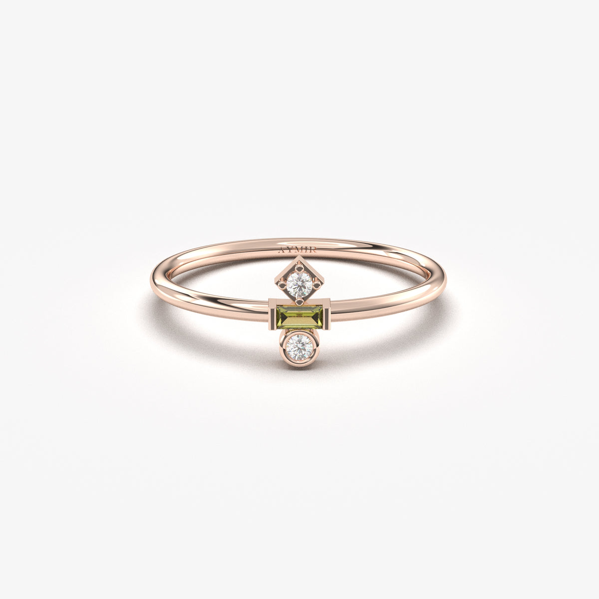 Rose gold green-stone baguette ring, front view