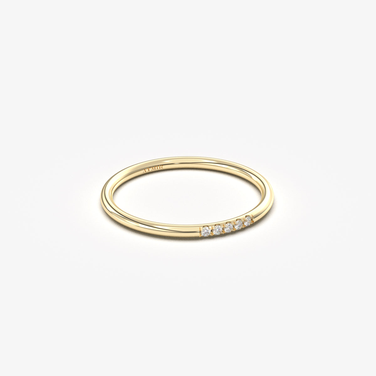 Yellow gold five-diamond thin ring, side view