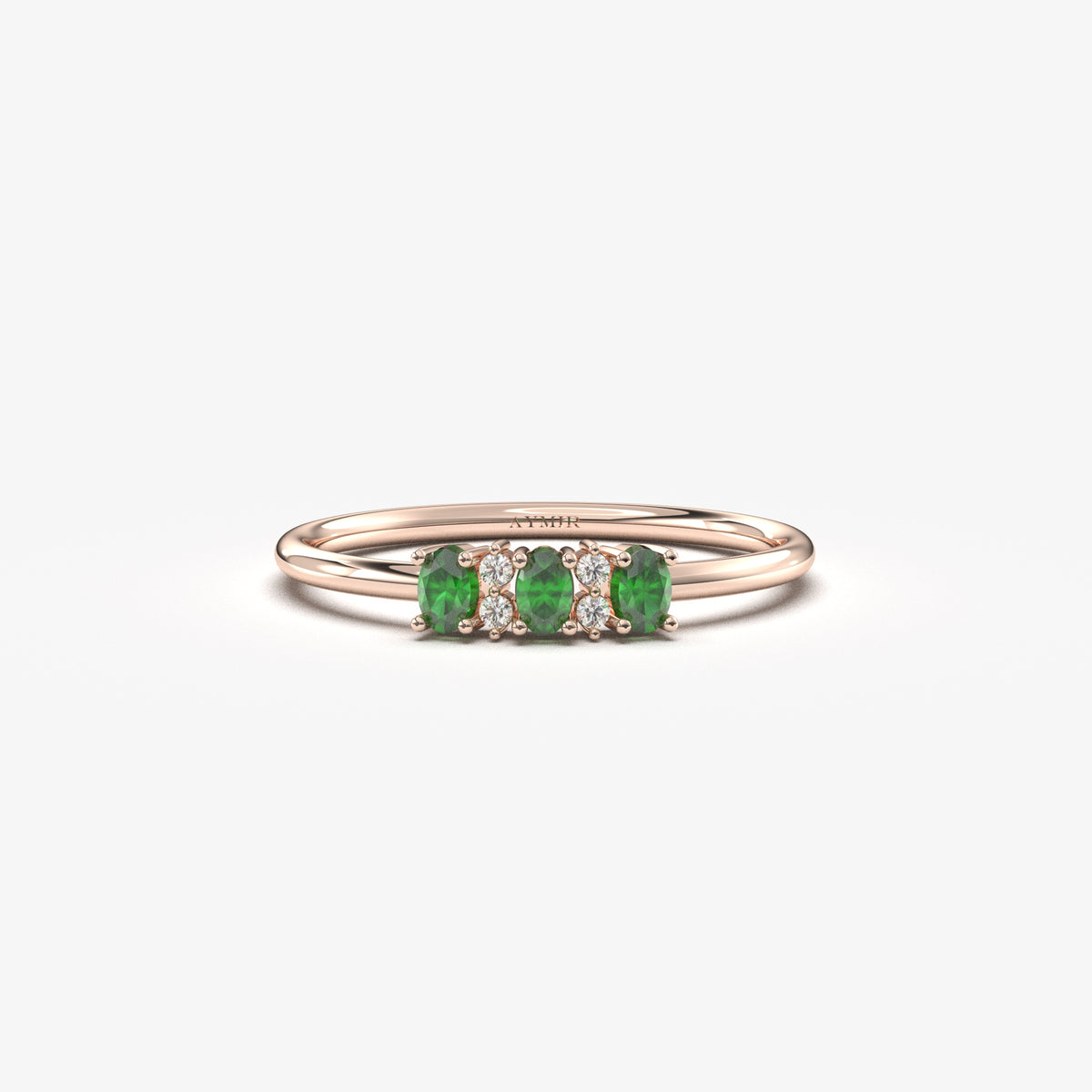Rose gold green-stone three oval ring, front view