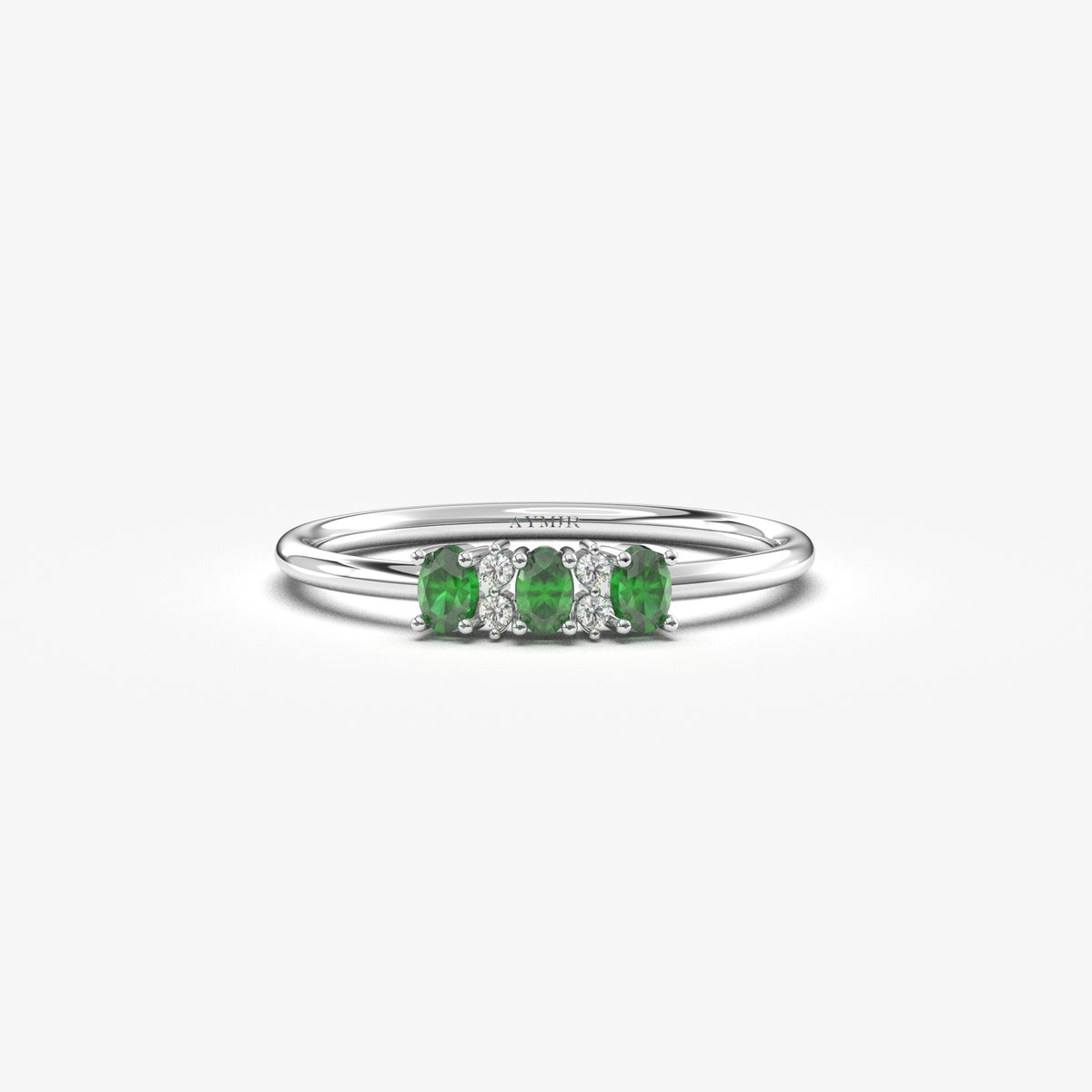 White gold green-stone three oval ring, front view