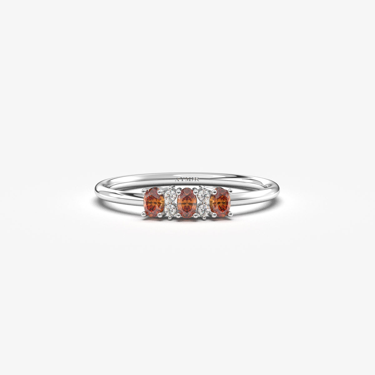 White gold dark-red-stone three oval ring, front view
