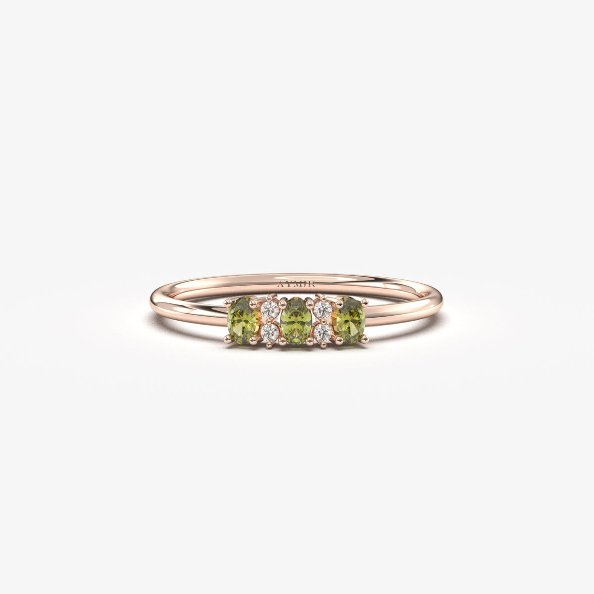 Rose gold green-stone three oval ring, front view